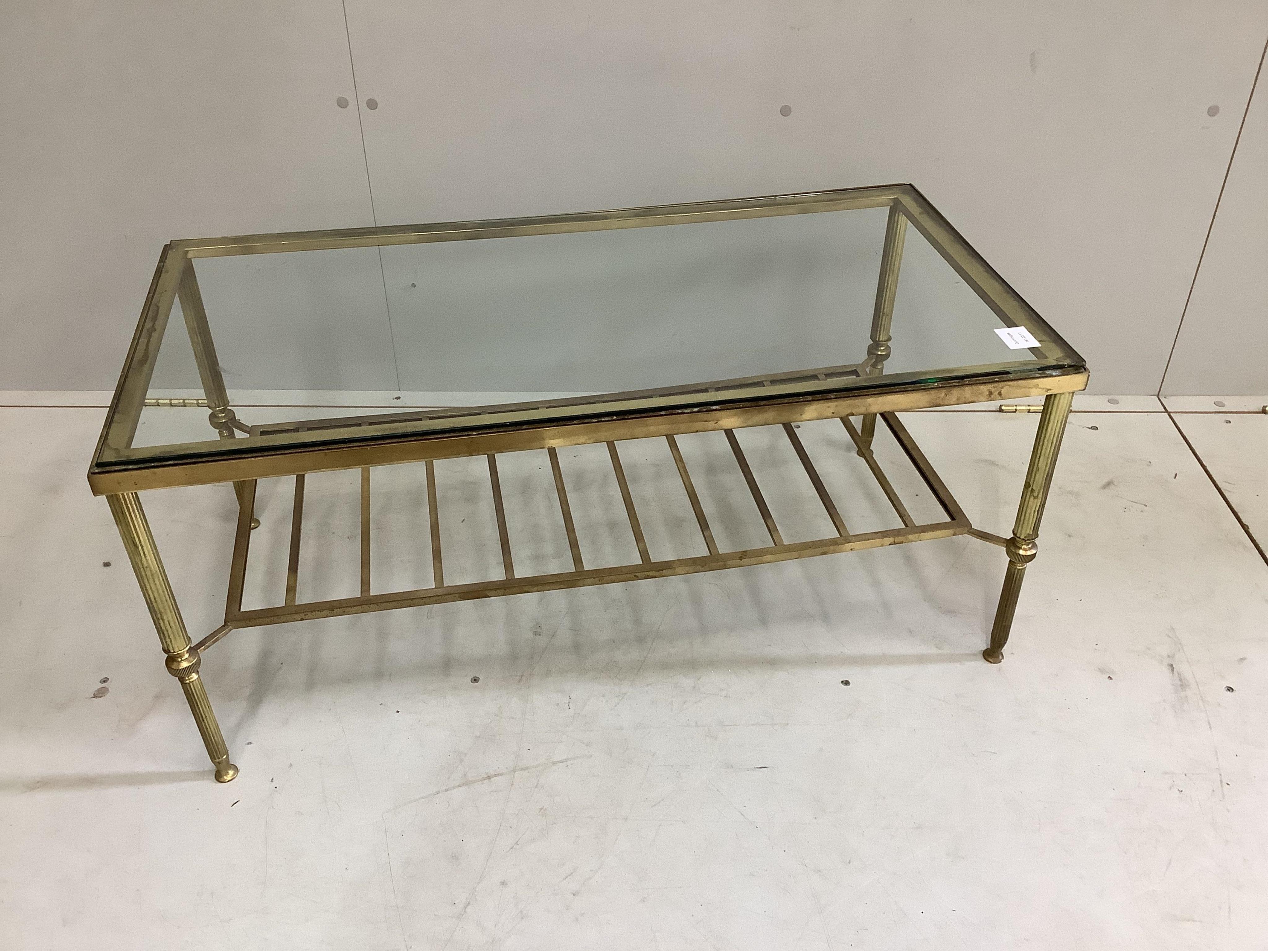 A Maison Jansen style rectangular brass two tier glass topped coffee table, width 92cm, depth 46cm, height 42cm